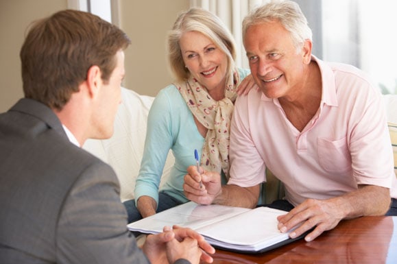 Couple getting financial advice from advisor